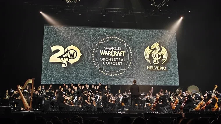 World of Warcraft Orchestral Concert: orchestra and choir on stage under the 20th anniversary screen